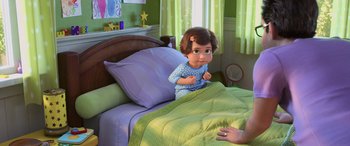 Movie still from “Toy Story 4” (2019), directed by Josh Cooley – A child is laying in a bed with a blanket; Medium shot, High angle