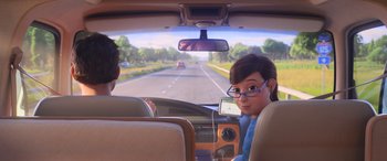 Movie still from “Toy Story 4” (2019), directed by Josh Cooley – A man and a woman in the back seat of a car; Medium shot, Over the shoulder angle