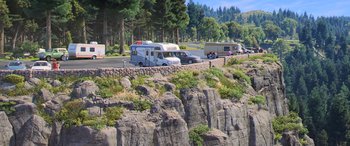 Movie still from “Toy Story 4” (2019), directed by Josh Cooley – A group of recreational vehicles parked along a road; Extreme Wide shot, High angle