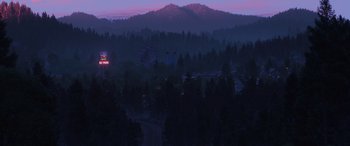 Movie still from “Toy Story 4” (2019), directed by Josh Cooley – A view of a ferris wheel and a mountain at night; Extreme Wide shot, High angle
