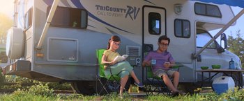 Movie still from “Toy Story 4” (2019), directed by Josh Cooley – A man and a woman sitting in front of an rv; Wide shot, High angle