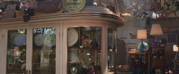 Movie still from “Toy Story 4” (2019), directed by Josh Cooley – A display case in a store filled with plates and dishes; Wide shot, High angle