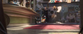 Movie still from “Toy Story 4” (2019), directed by Josh Cooley – An empty room with a red rug on the floor; Wide shot, High angle