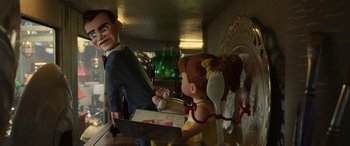 Movie still from “Toy Story 4” (2019), directed by Josh Cooley – A doll is holding a plate and a doll is holding a spoon; Medium shot, Over the shoulder angle