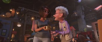 Movie still from “Toy Story 4” (2019), directed by Josh Cooley – A woman and an older woman are laughing together; Medium shot, Over the shoulder angle