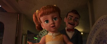 Movie still from “Toy Story 4” (2019), directed by Josh Cooley – A toy doll and a man in a room with lights on; Medium shot, Low angle