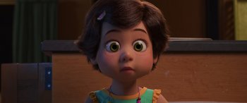 Movie still from “Toy Story 4” (2019), directed by Josh Cooley – A young girl with big green eyes looking at the camera; Close Up shot, Over the shoulder angle