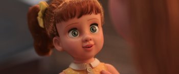 Movie still from “Toy Story 4” (2019), directed by Josh Cooley – A doll's face with green eyes; Extreme Close Up shot, Over the shoulder angle