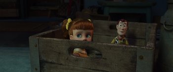 Movie still from “Toy Story 4” (2019), directed by Josh Cooley – A toy story doll in a wooden crate; Medium shot, Over the shoulder angle