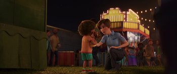 Movie still from “Toy Story 4” (2019), directed by Josh Cooley – A man is touching a little boy's face; Medium shot, Over the shoulder angle