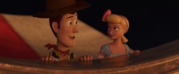 Movie still from “Toy Story 4” (2019), directed by Josh Cooley – A man and a woman sitting next to each other at a table; Medium shot, Over the shoulder angle