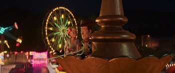 Movie still from “Toy Story 4” (2019), directed by Josh Cooley – A couple of people sitting next to each other on a ledge; Wide shot, Over the shoulder angle
