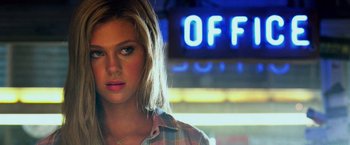 Movie still from “Transformers: Age of Extinction” (2014), directed by Michael Bay – A person wearing a plaid shirt; Close Up shot, Over the shoulder angle