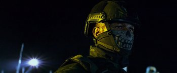 Movie still from “Transformers: Age of Extinction” (2014), directed by Michael Bay – A man wearing a helmet and a face mask; Close Up shot, Over the shoulder angle