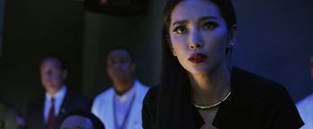 Movie still from “Transformers: Age of Extinction” (2014), directed by Michael Bay – A woman in a black shirt and a man in a white shirt; Close Up shot, Over the shoulder angle