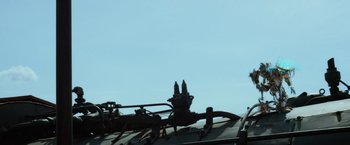 Movie still from “Transformers: Age of Extinction” (2014), directed by Michael Bay – View of the top part of a train; Medium shot, Low angle