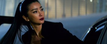 Movie still from “Transformers: Age of Extinction” (2014), directed by Michael Bay – A person wearing a suit; Close Up shot, Low angle