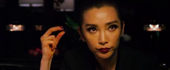 Movie still from “Transformers: Age of Extinction” (2014), directed by Michael Bay – A person wearing a black jacket; Close Up shot, Over the shoulder angle