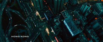 Movie still from “Transformers: Age of Extinction” (2014), directed by Michael Bay – An aerial view of a city at night with lights; Extreme Wide shot, Overhead angle