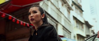 Movie still from “Transformers: Age of Extinction” (2014), directed by Michael Bay – A woman with long black hair is looking at the camera; Close Up shot, Low angle