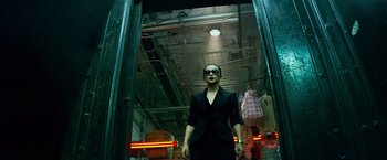 Movie still from “Transformers: Age of Extinction” (2014), directed by Michael Bay – A woman standing in front of an open door; Medium shot, Low angle