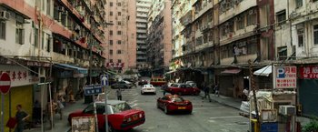 Movie still from “Transformers: Age of Extinction” (2014), directed by Michael Bay – A busy street with cars and buildings in the background; Extreme Wide shot, High angle