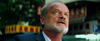 Movie still from “Transformers: Age of Extinction” (2014), directed by Michael Bay – An older man with a beard looking upward; Close Up shot, Low angle