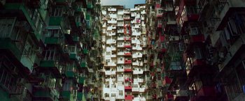 Movie still from “Transformers: Age of Extinction” (2014), directed by Michael Bay – A very tall building with lots of balconies on it's side; Extreme Wide shot, Overhead angle