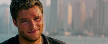 Movie still from “Transformers: Age of Extinction” (2014), directed by Michael Bay – A person with a bruise on his face; Close Up shot, Over the shoulder angle