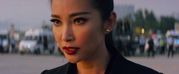 Movie still from “Transformers: Age of Extinction” (2014), directed by Michael Bay – A person wearing a jacket; Close Up shot, Over the shoulder angle