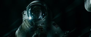 Movie still from “Transformers: Dark of the Moon” (2011), directed by Michael Bay – A man in a spacesuit with a helmet on; Medium shot, Overhead angle