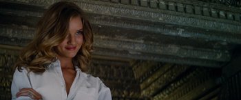 Movie still from “Transformers: Dark of the Moon” (2011), directed by Michael Bay – A beautiful young woman with a white dress shirt; Close Up shot, Low angle