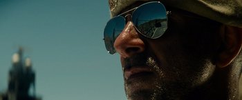 Movie still from “Transformers: Dark of the Moon” (2011), directed by Michael Bay – A person wearing sunglasses; Close Up shot, Low angle