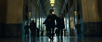 Movie still from “Transformers: Dark of the Moon” (2011), directed by Michael Bay – A man and a woman walking down a hall way; Wide shot, Low angle