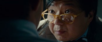 Movie still from “Transformers: Dark of the Moon” (2011), directed by Michael Bay – An older woman wearing glasses looking into a mirror; Close Up shot, Over the shoulder angle