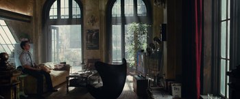 Movie still from “Transformers: Dark of the Moon” (2011), directed by Michael Bay – A living room filled with furniture and a flat screen tv; Wide shot, High angle