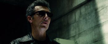 Movie still from “Transformers: Dark of the Moon” (2011), directed by Michael Bay – A person wearing sunglasses; Close Up shot, Low angle