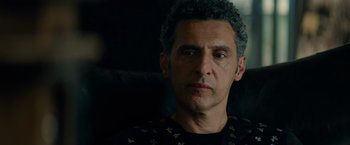 Movie still from “Transformers: Dark of the Moon” (2011), directed by Michael Bay – A person sitting in a chair; Close Up shot, Over the shoulder angle