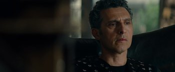 Movie still from “Transformers: Dark of the Moon” (2011), directed by Michael Bay – A person sitting in a chair; Close Up shot, Over the shoulder angle