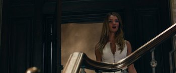 Movie still from “Transformers: Dark of the Moon” (2011), directed by Michael Bay – A beautiful young woman standing in front of a bathroom mirror; Medium shot, Over the shoulder angle