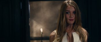Movie still from “Transformers: Dark of the Moon” (2011), directed by Michael Bay – A beautiful young woman with long , blonde hair; Close Up shot, Over the shoulder angle