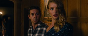 Movie still from “Transformers: Dark of the Moon” (2011), directed by Michael Bay – A man and a woman standing next to each other in a room; Close Up shot, Low angle