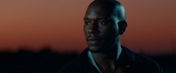 Movie still from “Transformers: Dark of the Moon” (2011), directed by Michael Bay – A person wearing a black shirt; Close Up shot, Low angle