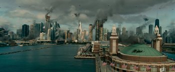 Movie still from “Transformers: Dark of the Moon” (2011), directed by Michael Bay – An image of an urban scene with smoke coming out of the sky; Extreme Wide shot, High angle