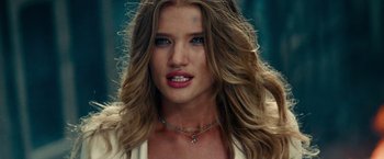 Movie still from “Transformers: Dark of the Moon” (2011), directed by Michael Bay – A person with long hair; Close Up shot, Over the shoulder angle