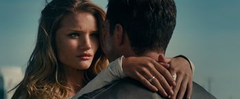 Movie still from “Transformers: Dark of the Moon” (2011), directed by Michael Bay – A man and a woman embracing each other outside; Close Up shot, Over the shoulder angle