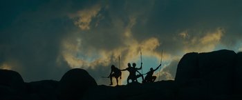 Movie still from “Transformers: Revenge of the Fallen” (2009), directed by Michael Bay – A group of people standing on top of a hill; Extreme Wide shot, Low angle