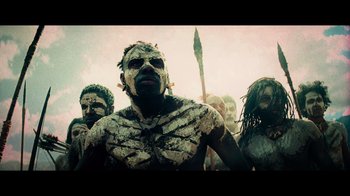 Movie still from “Transformers: Revenge of the Fallen” (2009), directed by Michael Bay – A group of people with face paint and body paint; Medium shot, Low angle