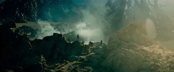 Movie still from “Transformers: Revenge of the Fallen” (2009), directed by Michael Bay – A group of people standing on top of a mountain; Extreme Wide shot, High angle