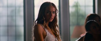 Movie still from “Transformers: Revenge of the Fallen” (2009), directed by Michael Bay – A beautiful young woman with long brown hair; Close Up shot, Low angle